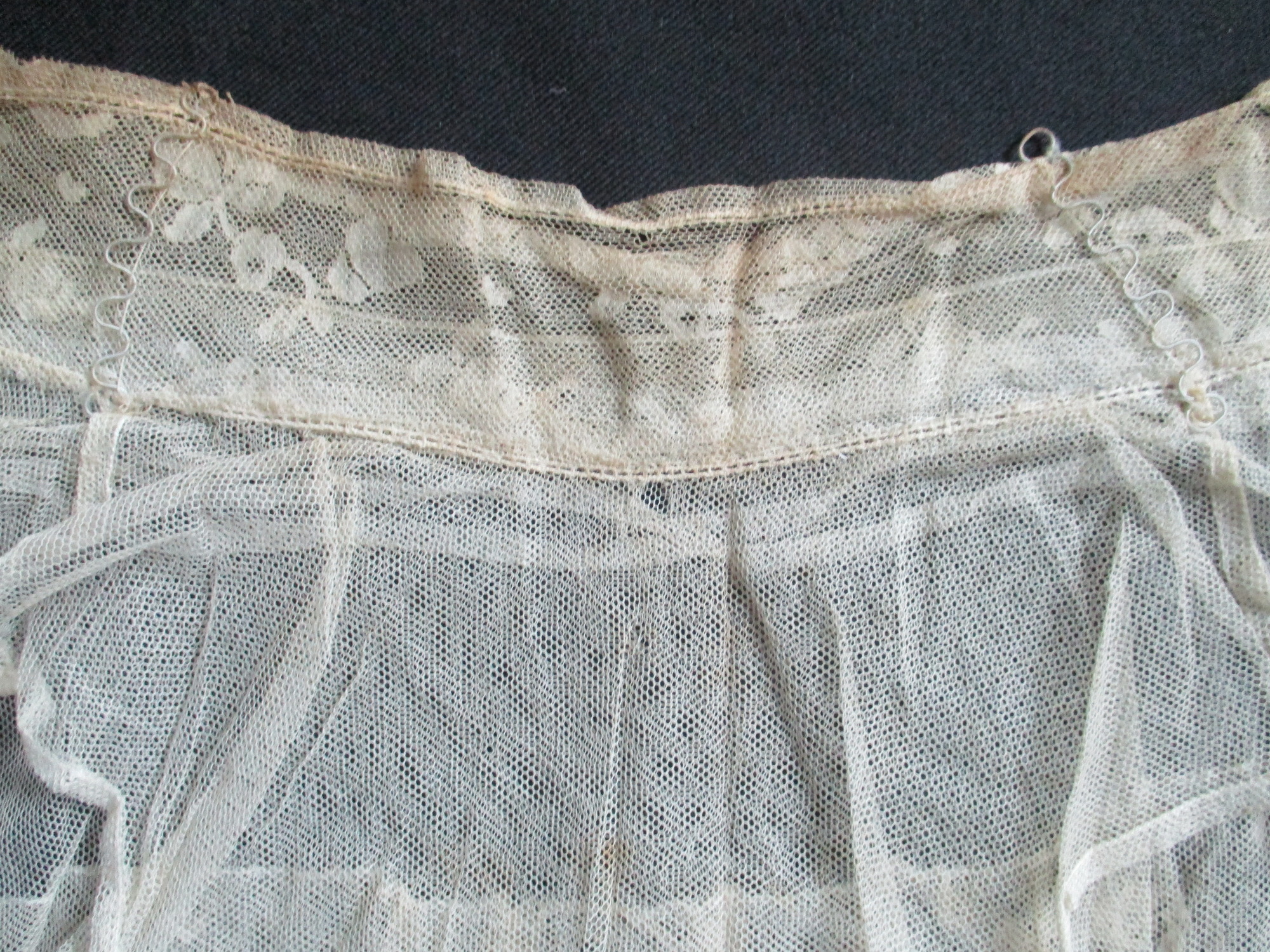 Bib and Collar: Close up of collar highlighting the wire stiffeners.