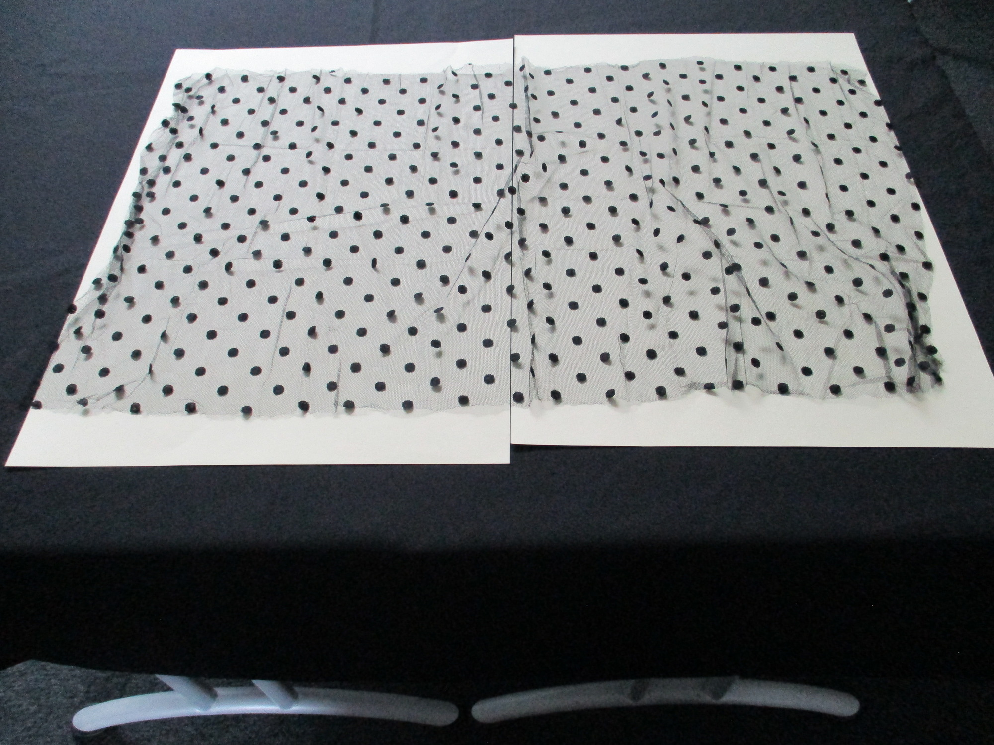 Black lace netting: Spotted black netting.