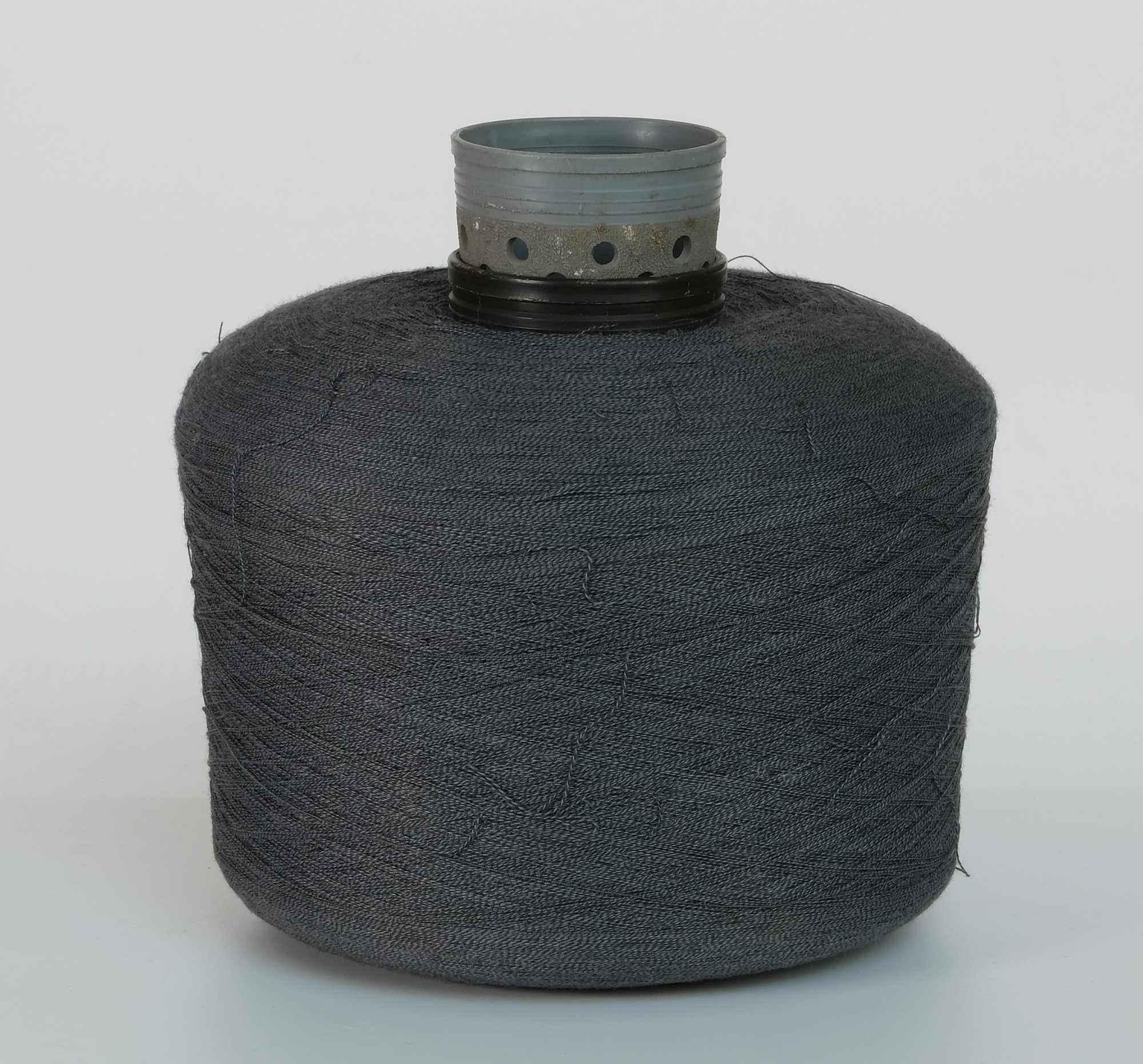 Bobbin of dark grey yarn