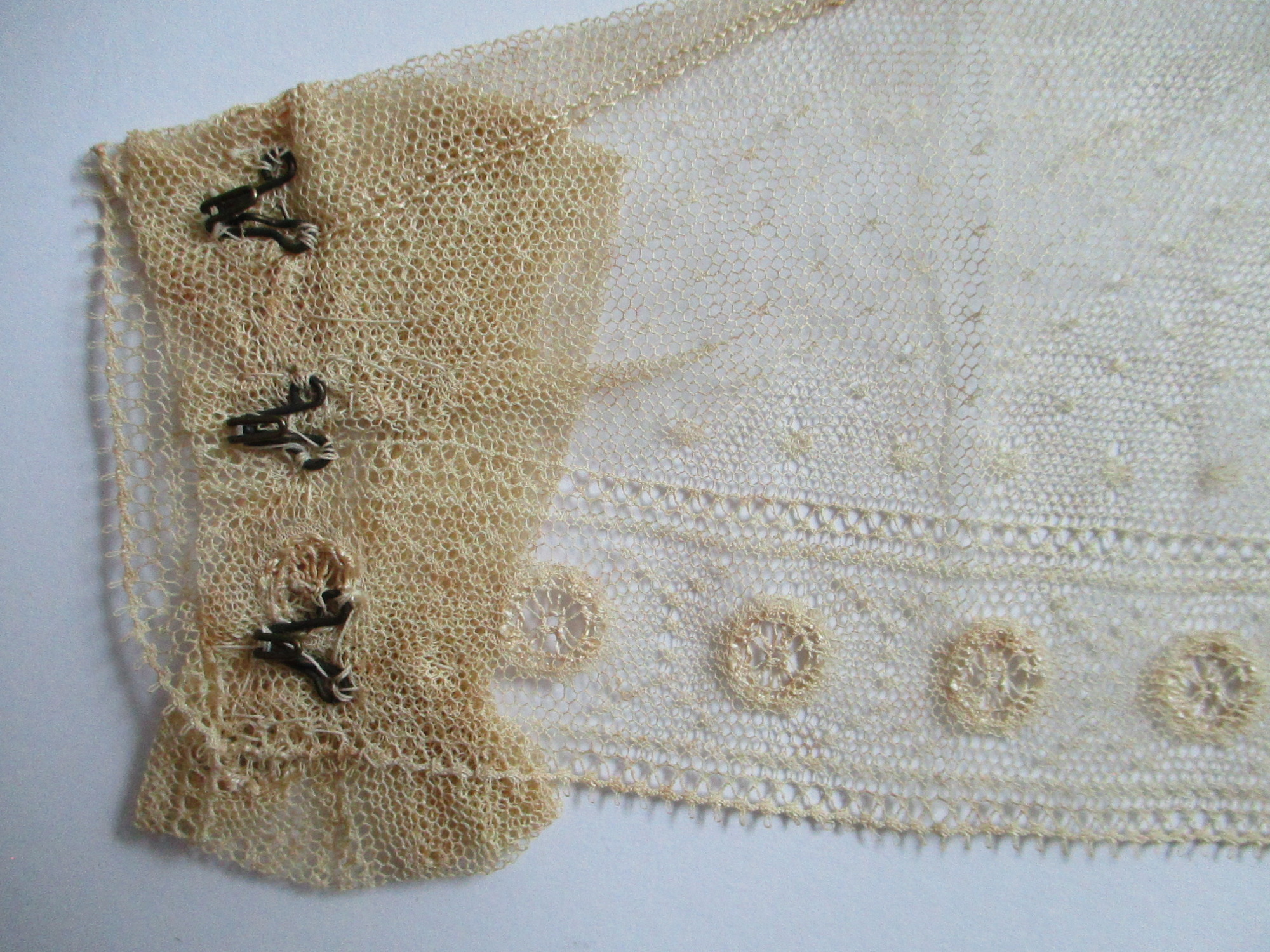 Child's cream collar.: Hook fastening on child's handmade cream collar.(ii)