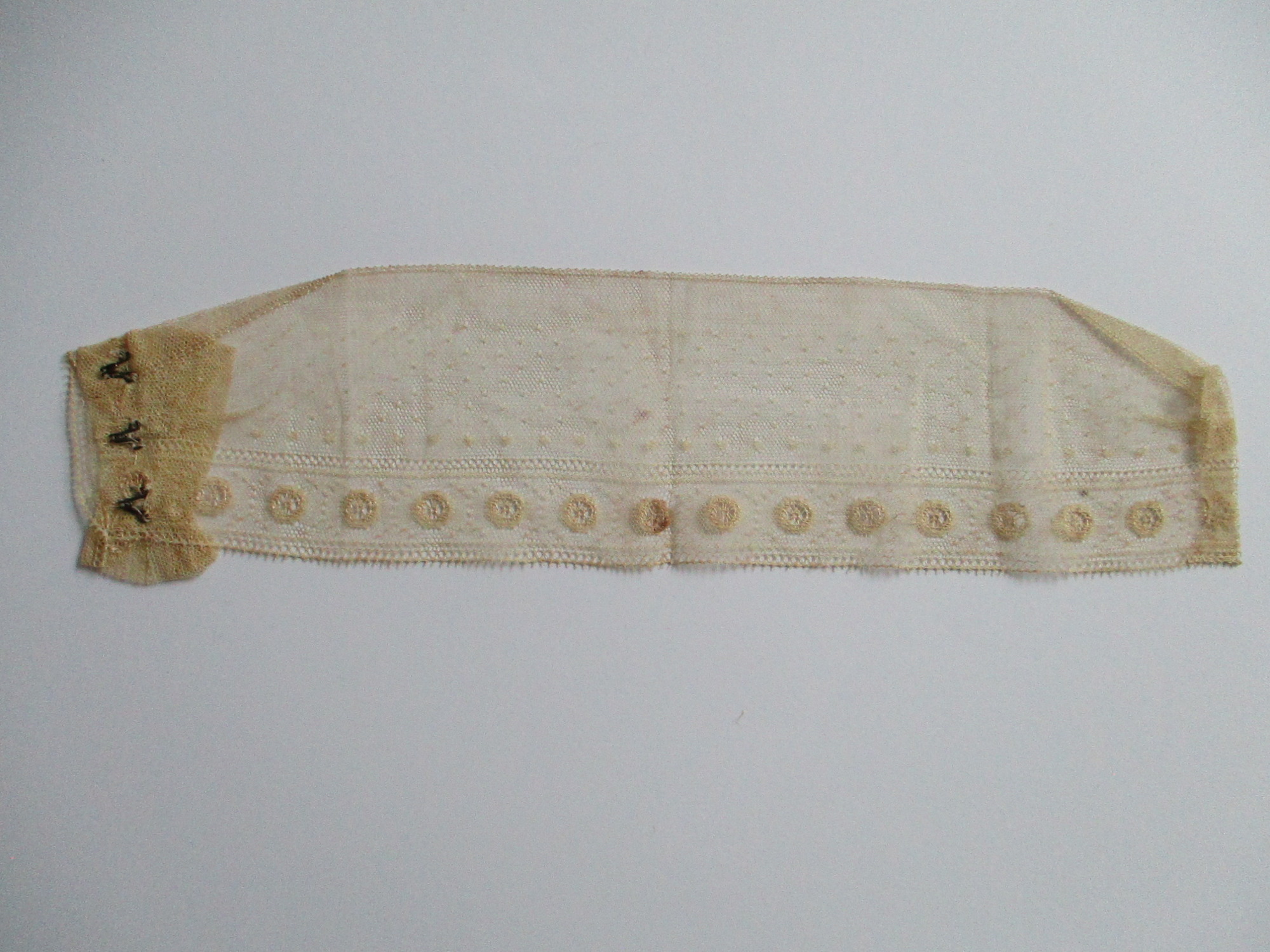 Child's cream collar.: Reverse view of child's handmade cream collar.