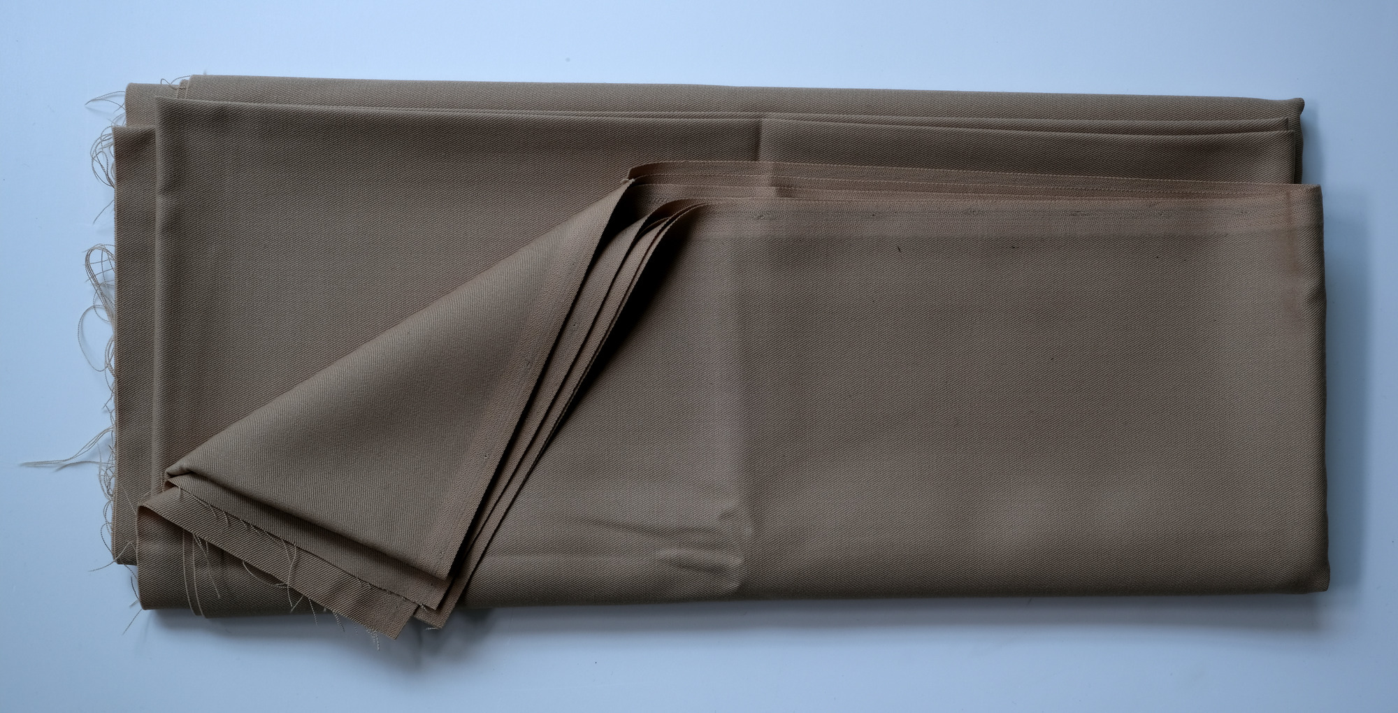 Length of beige cloth: View showing cloth folded back twice