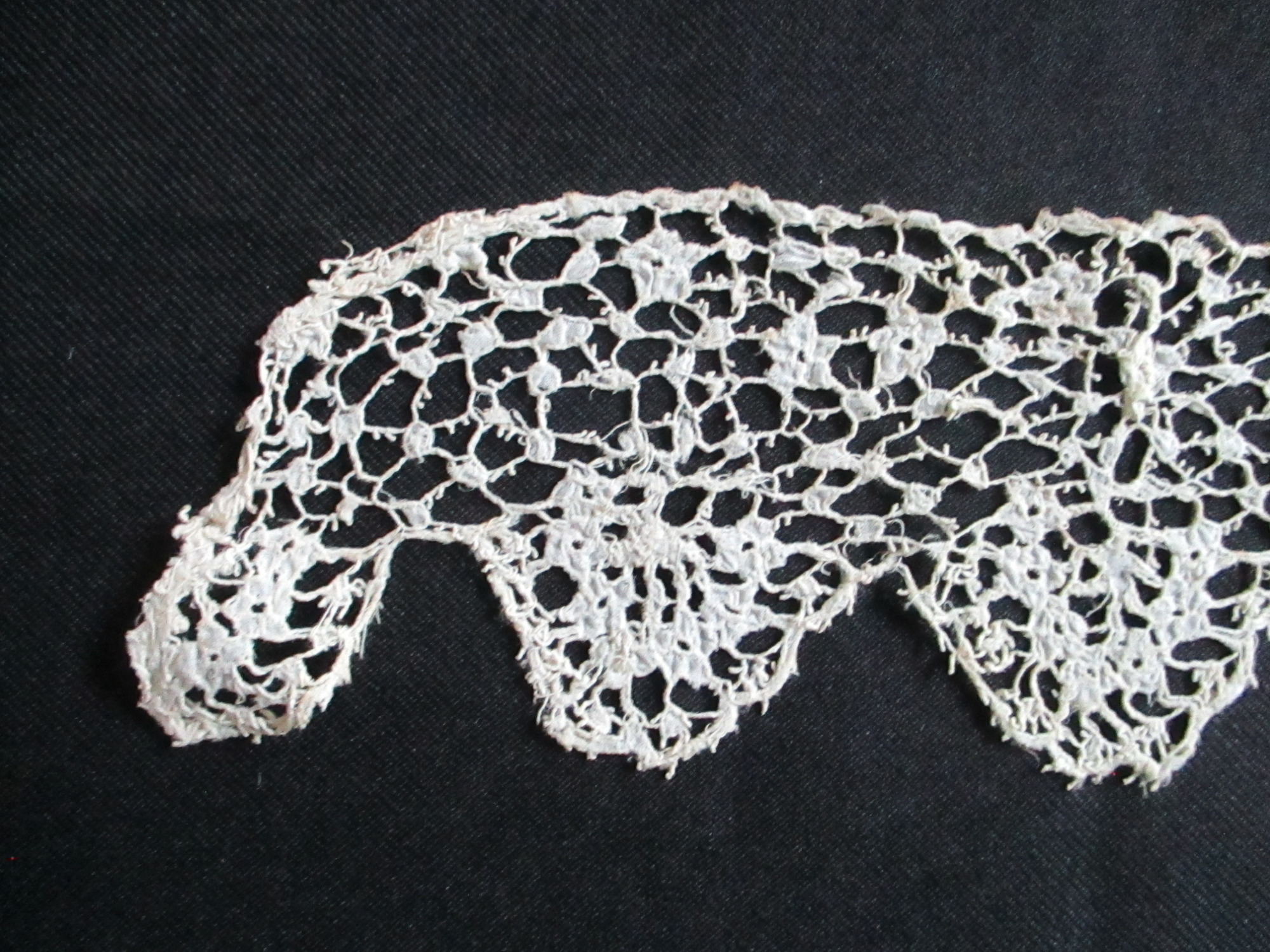 Length of cream silk lace.: End detail of cream silk lace. (ii)