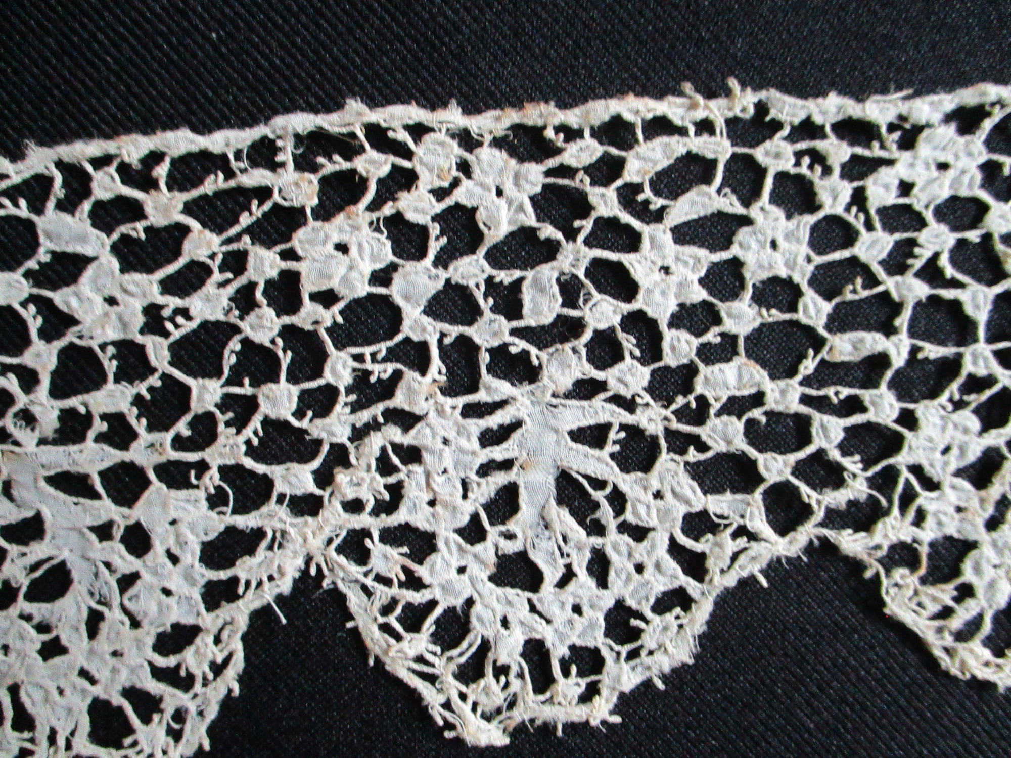 Length of cream silk lace.: Close-up detail of cream silk lace.(ii)
