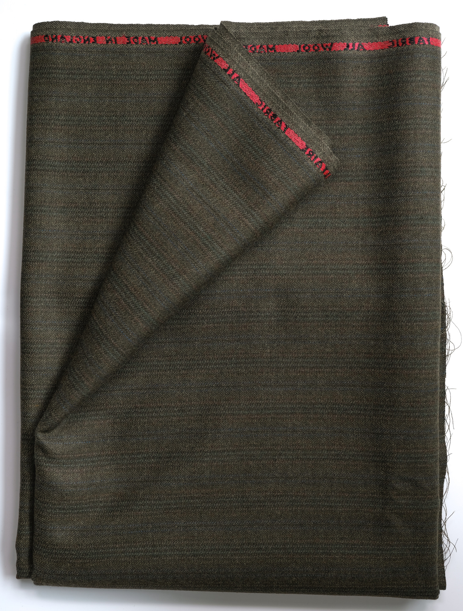 Length of dark green all-wool cloth: View showing cloth folded back once