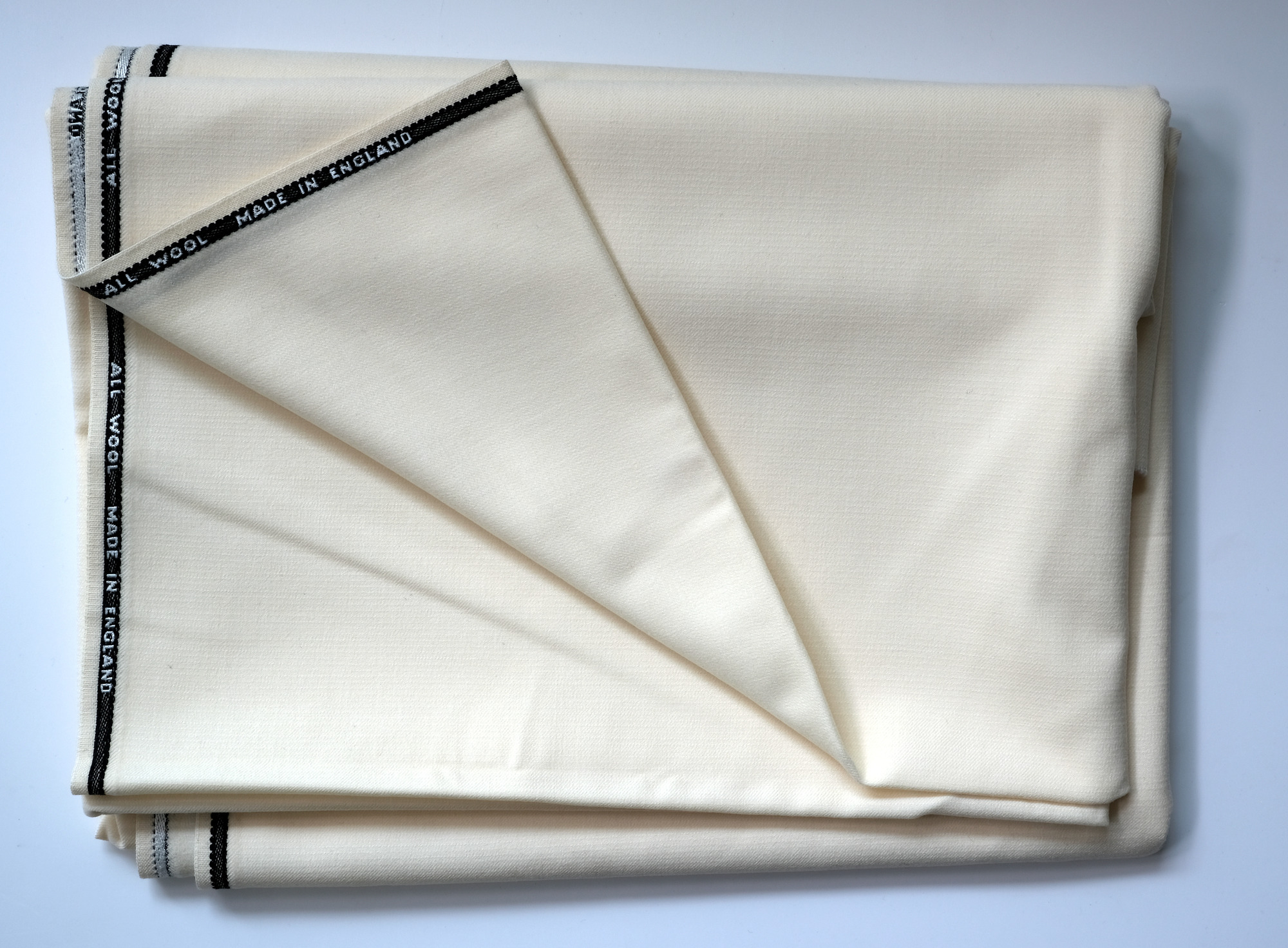Length of white cloth: View showing cloth folded back once