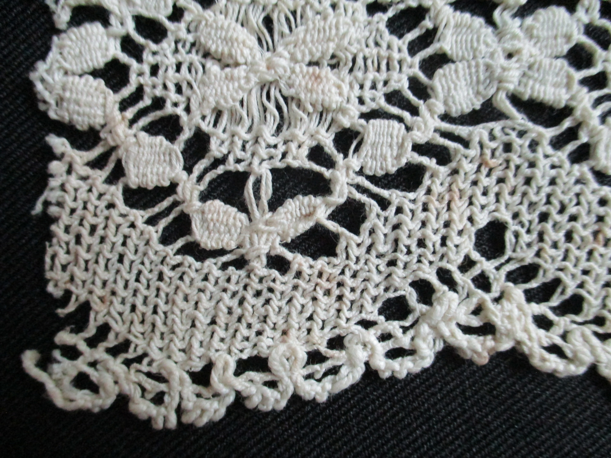 Piece of cream cotton lace.: Edge detail of cream cotton lace (ii)