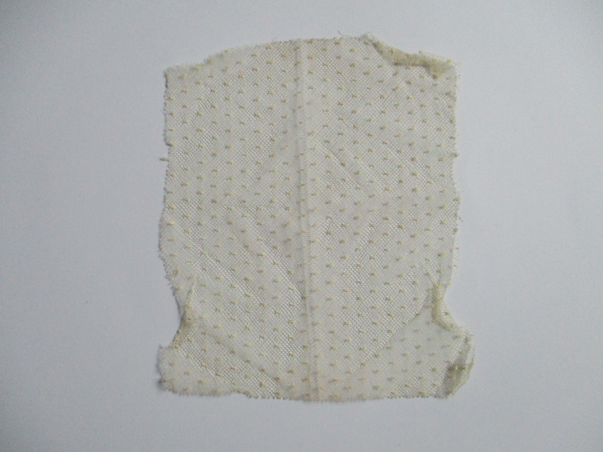 Piece of cream netting.