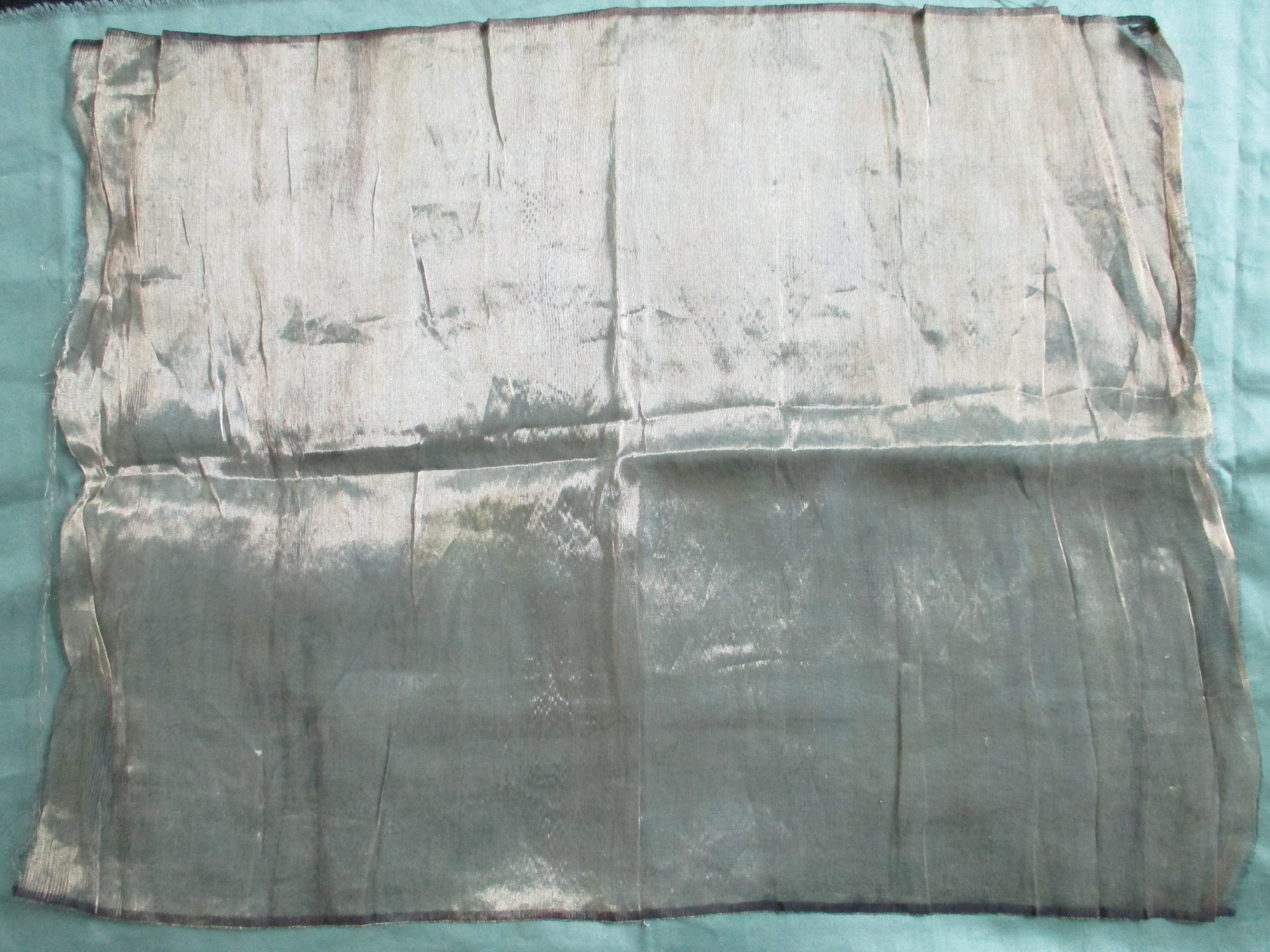 Piece of gold satin material