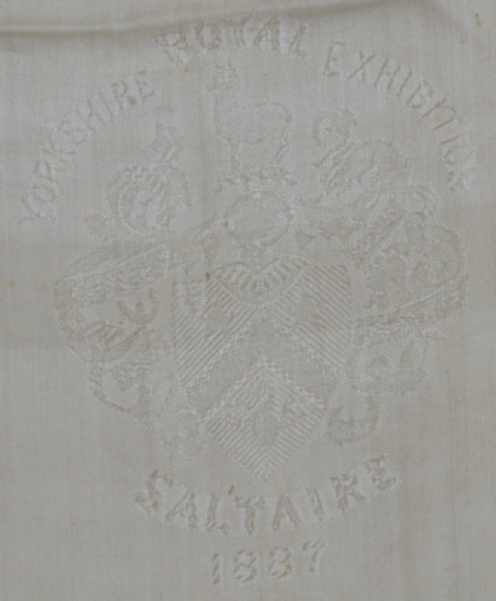 Silk scarf: Detail of one section of scarf showing Exhibition motif