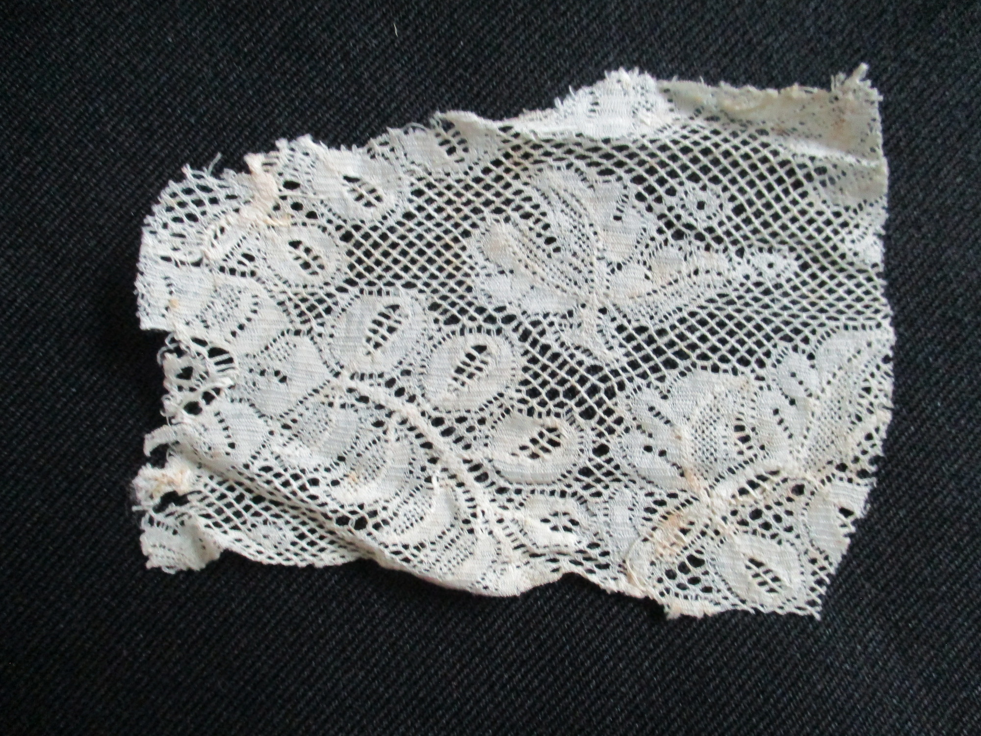Small piece of cream lace.