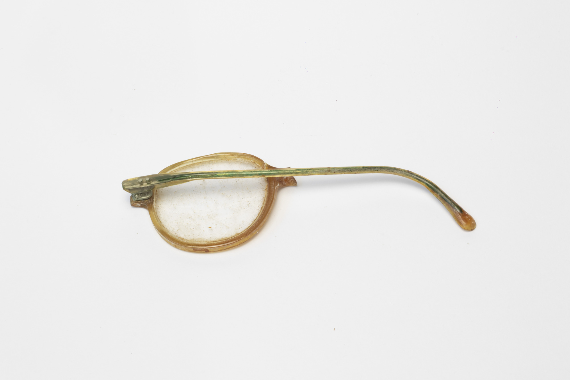 Spectacles: Left hand lens, rear view