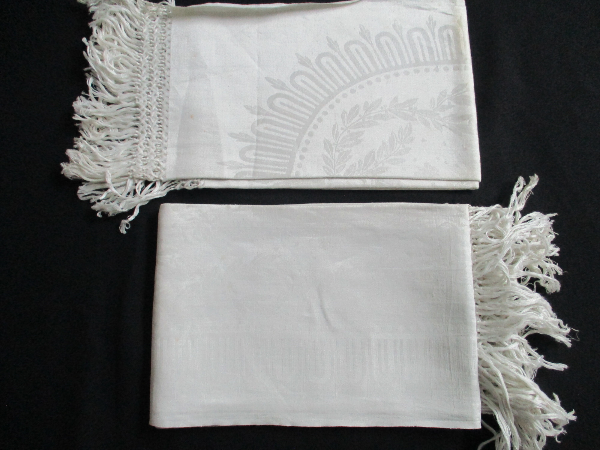 Two fringed damask towels
