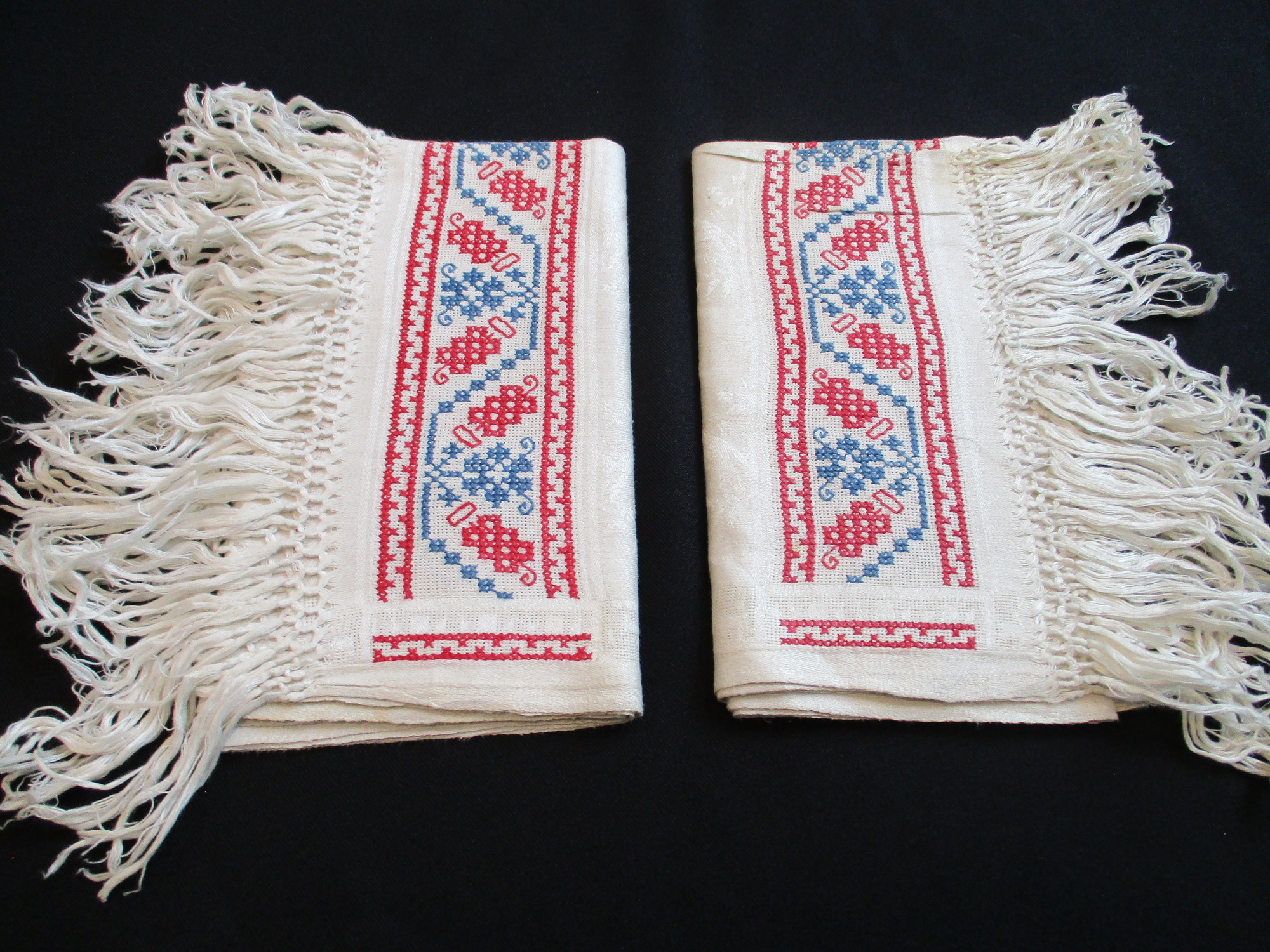 Two fringed towels: Towels folded.