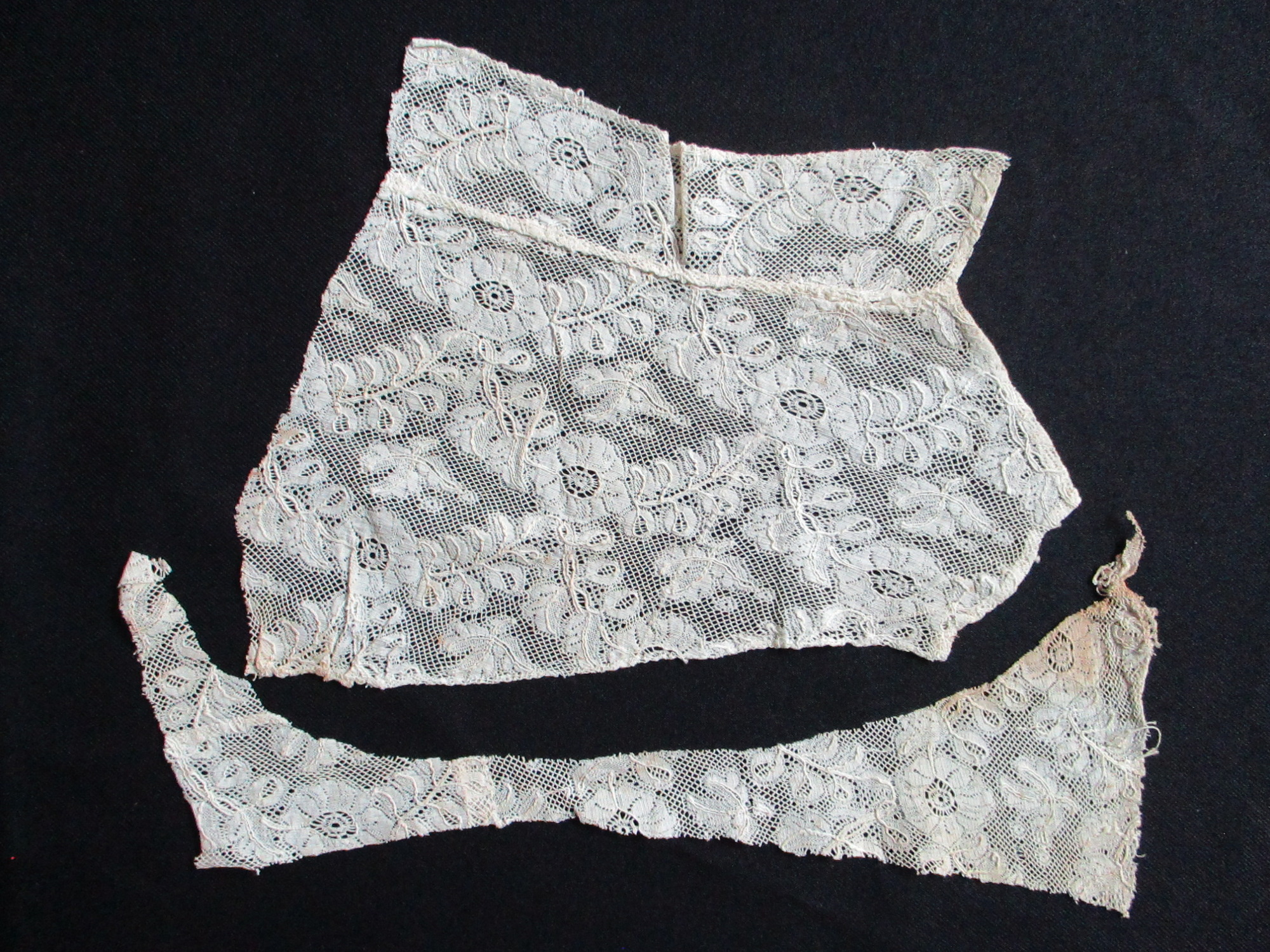 Two pieces of cream silk lace.