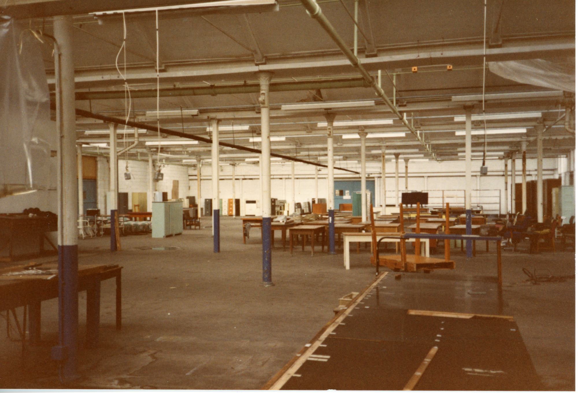 Empty room with columns and benches