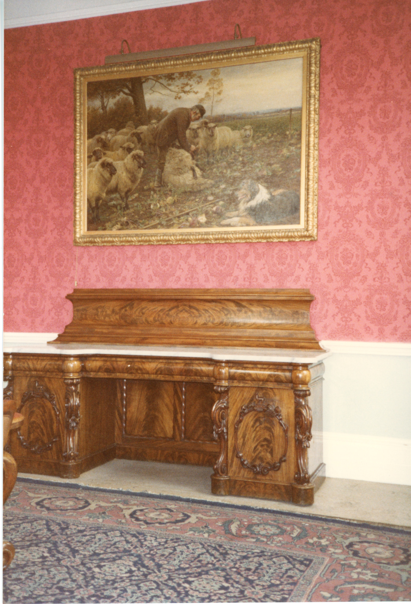 Painting of sheep shearers and sideboard in the boardroom